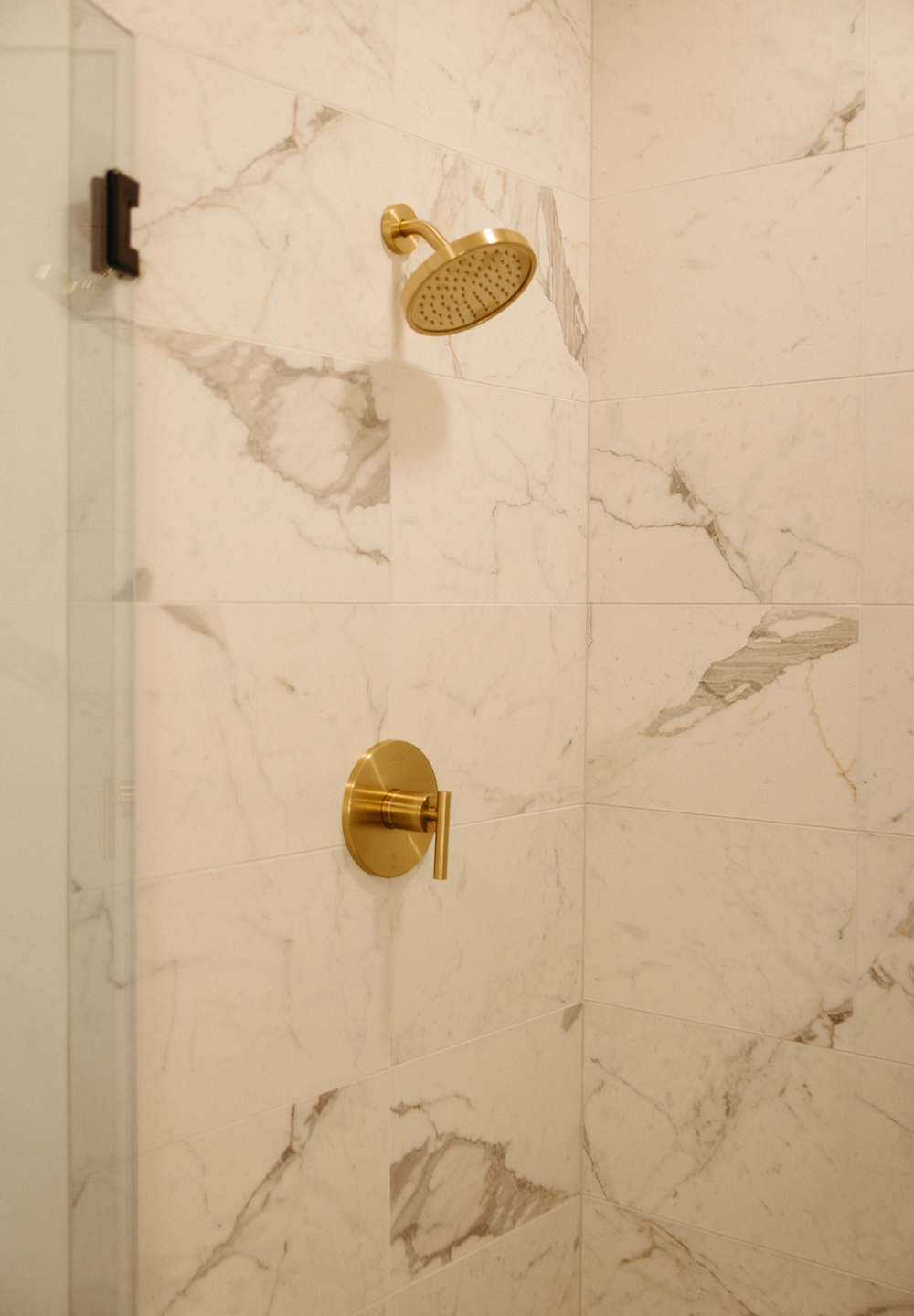 Marble tile and gold finishes in Moontower's bathrooms.