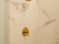 Marble tile and gold finishes in Moontower's bathrooms.