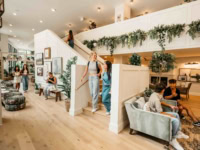 Girls walking down stairs in Rambler Athen's lobby.