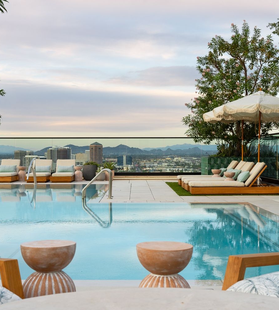 Image of Moontower's rooftop pool deck overlooking the downtown Phoenix skyline.