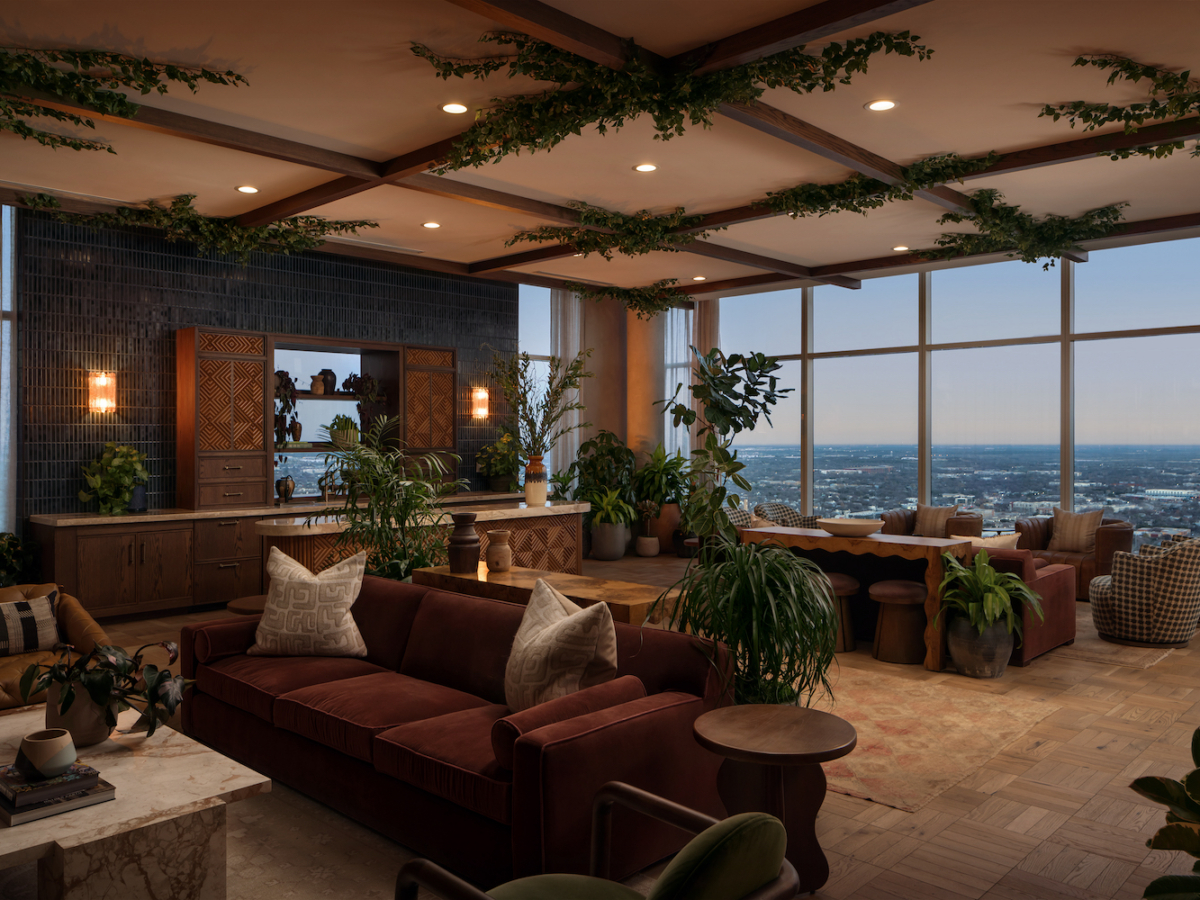 A spacious, modern living room with large windows offering a city view, inspired by Paseo elegance. Velvet sofas, lush green plants, wooden furniture, and ceiling greenery create a stylish, cozy atmosphere.