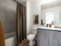 Representative bathrooms with a shower/tub combo at Rambler Atlanta.