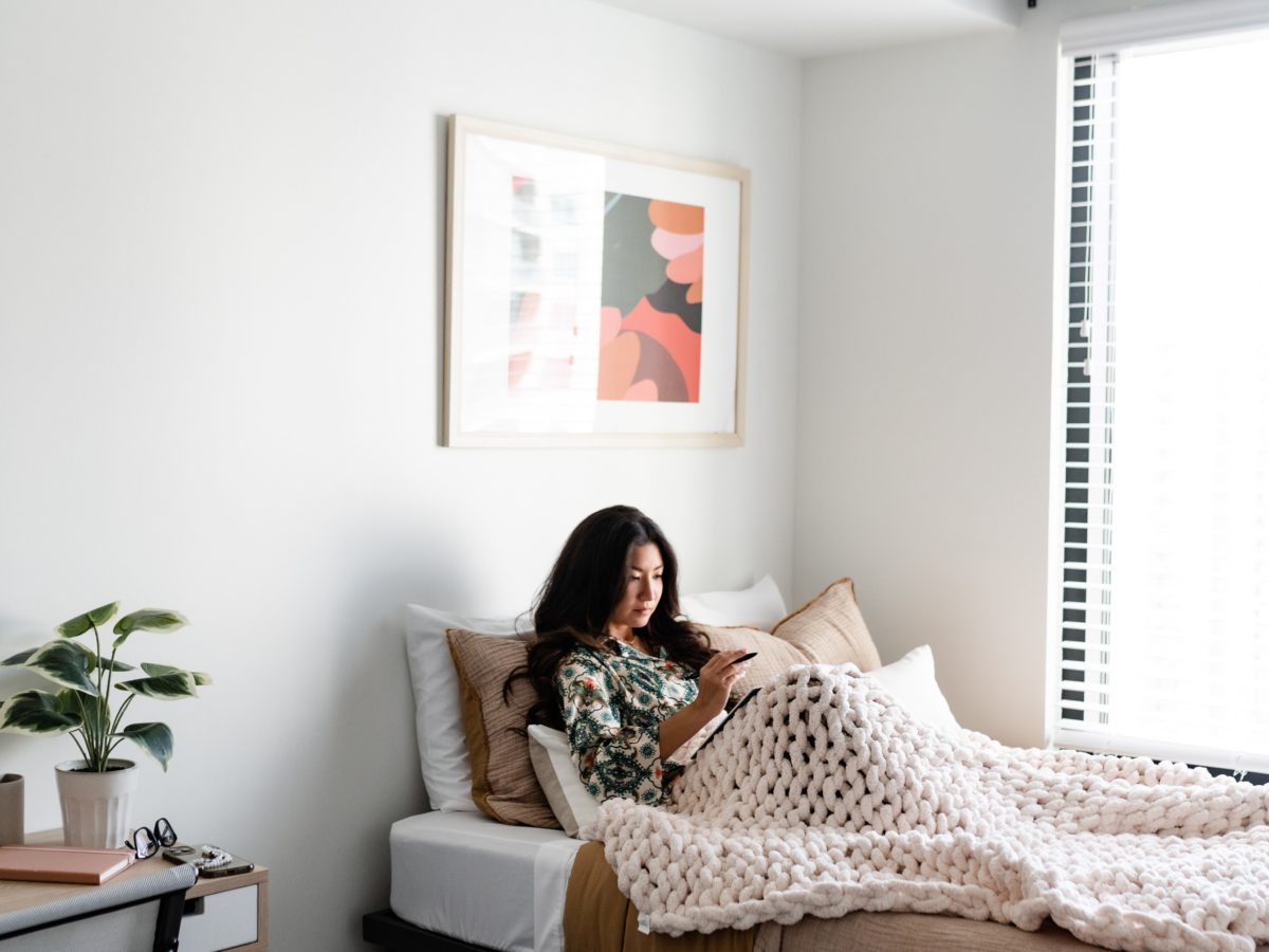 Girl reading in bed at Whistler ATL
