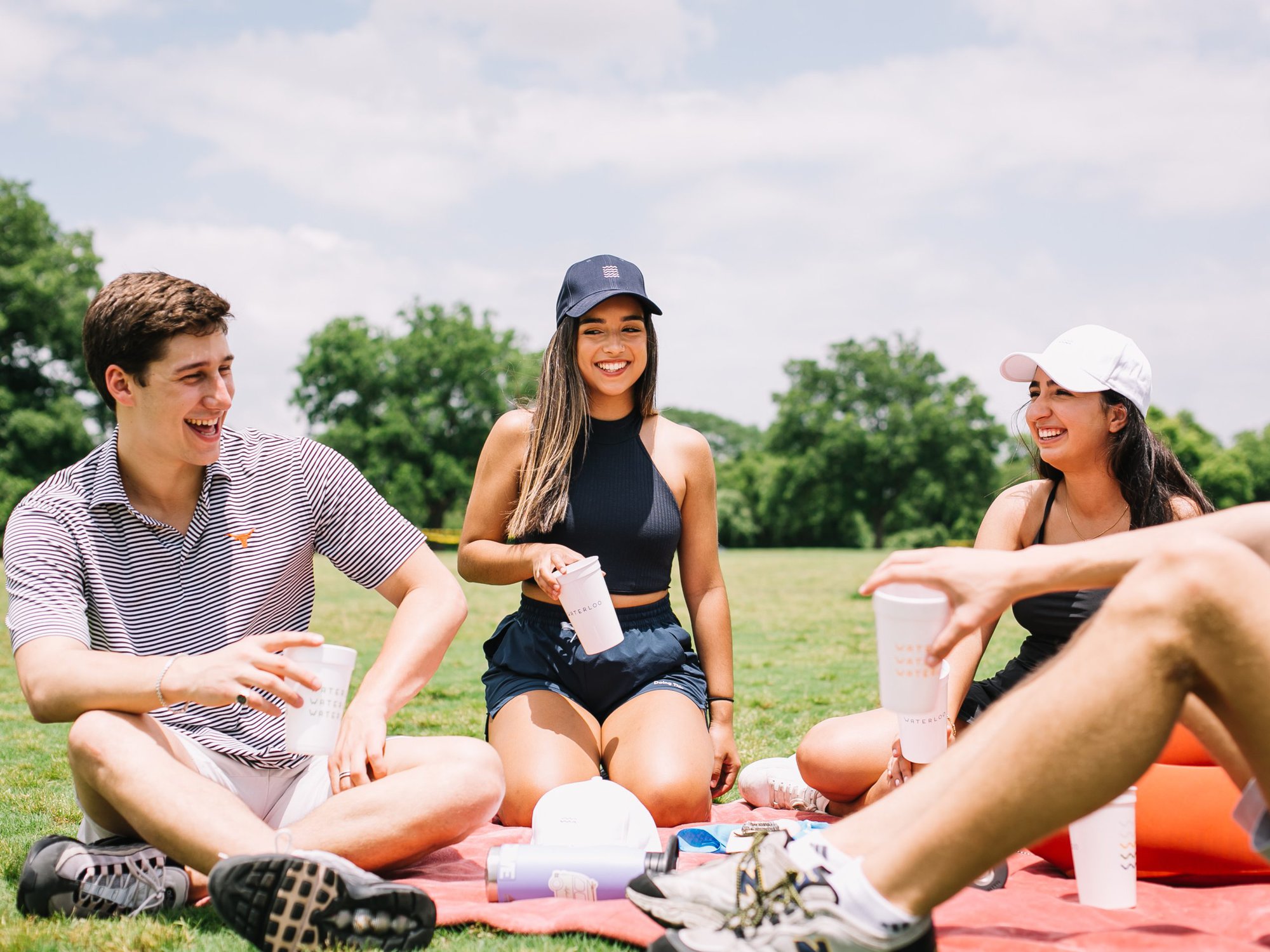 Waterloo brand ambassadors at the park with Waterloo merch