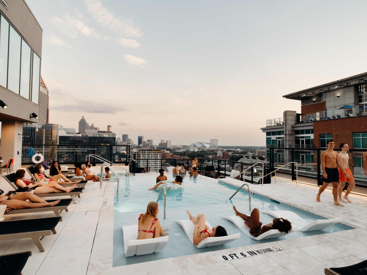 Whistler Atlanta pool deck with students tanning
