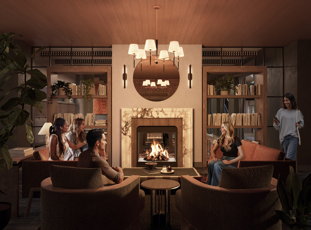 Five people relax in a cozy, elegant living room with a fireplace, modern furniture, bookshelves, and warm lighting. Some sit and talk, while one person enters the room holding a mug.