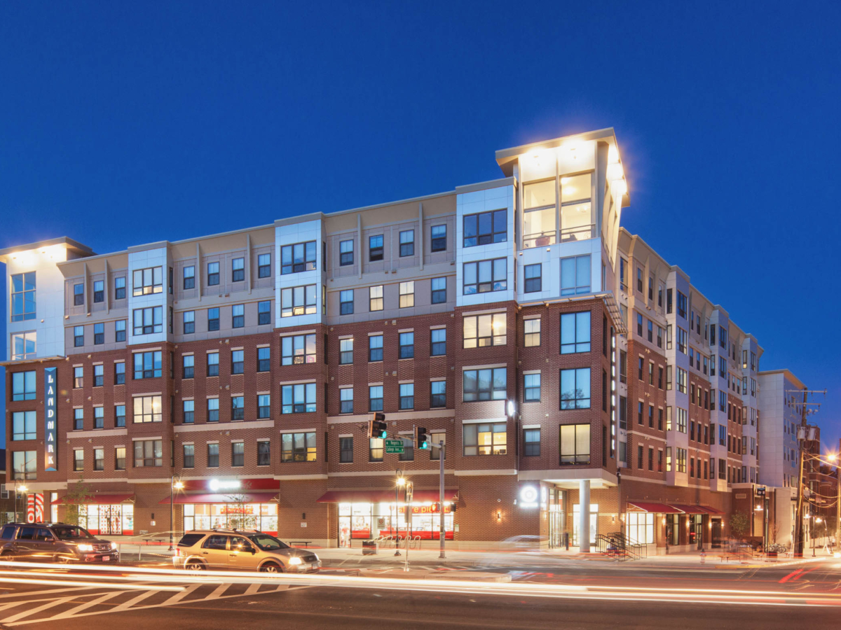 Landmark College Park building with many windows and a street light at night.