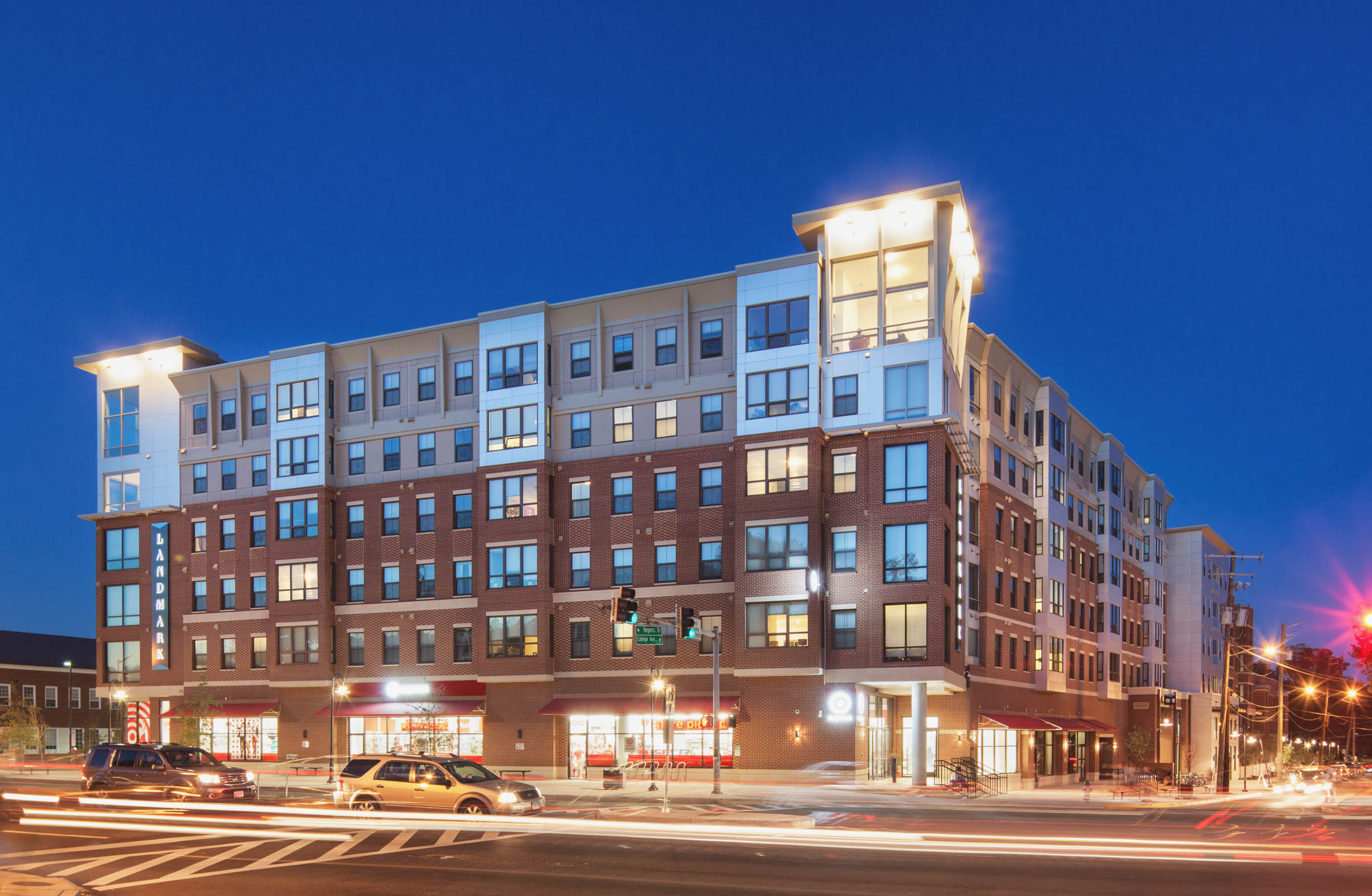 Landmark College Park building with many windows and a street light at night.