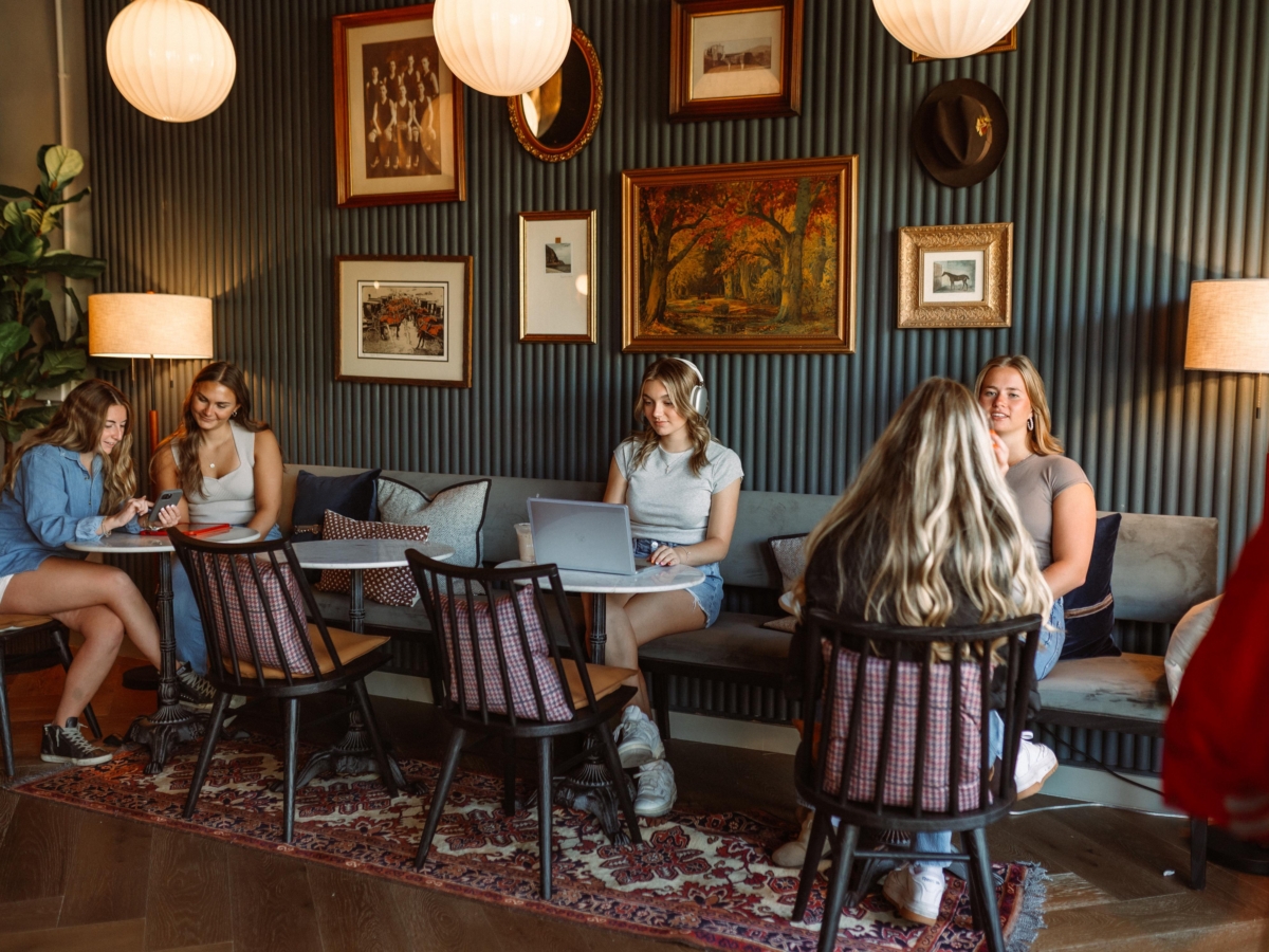 Students in the lobby of Rambler Columbus, a student housing community near the Ohio State University.