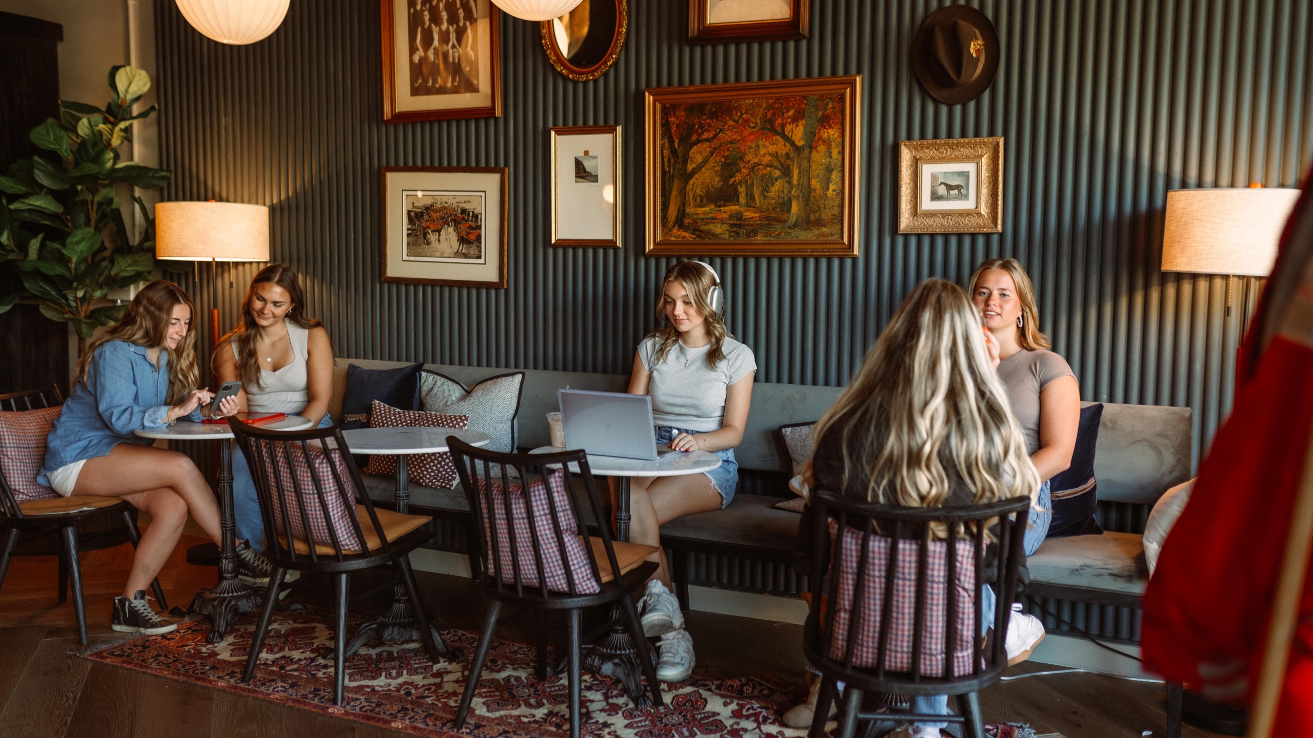 Students in lobby of Rambler Columbus, a student housing community near Ohio State University.