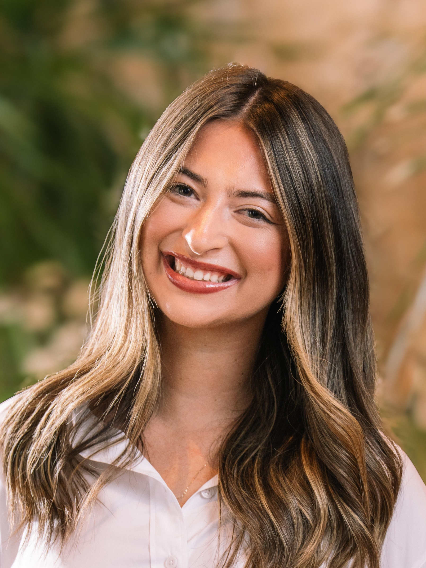 Kacey Ogden, Social Media Coordinator at LV Collective, poses for a headshot photo.